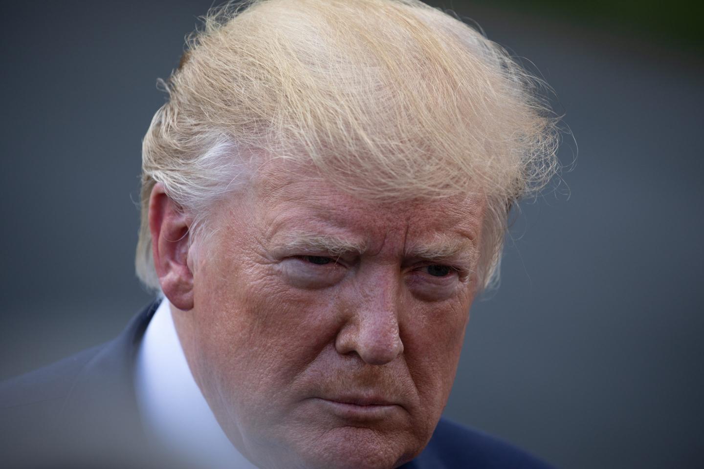 U.S. President Donald Trump speaks to members of the press