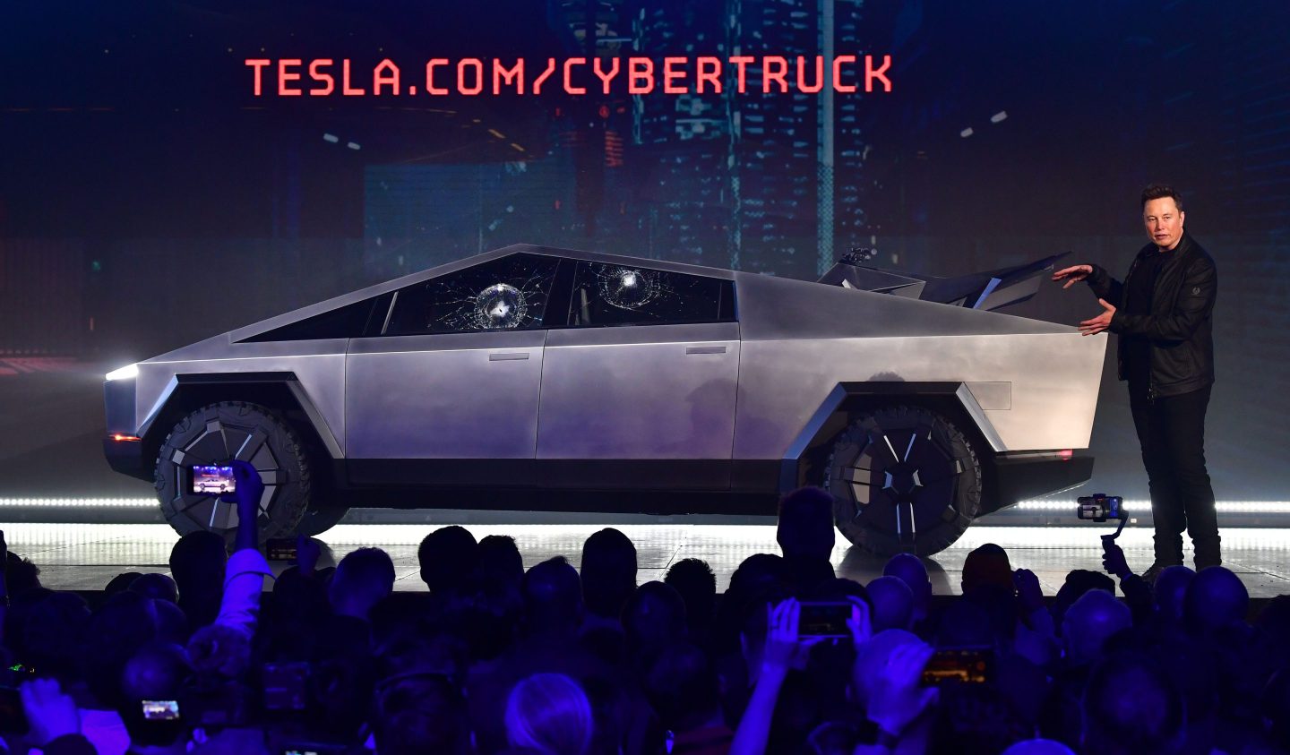 Tesla co-founder and CEO Elon Musk gestures while wrapping up his presentation of the newly unveiled all-electric battery-powered Tesla Cybertruck at Tesla Design Center in Hawthorne, California on November 21, 2019.