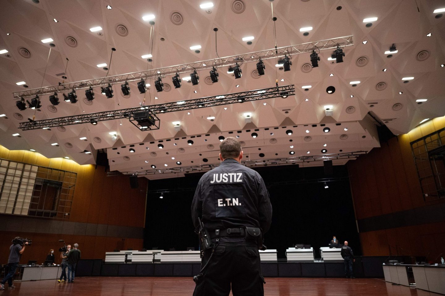 A justice officer stands in a courtroom prior to the continuation of a trial against four former executives at German car maker Volkswagen (VW) charged with misconduct over their role in the carmaker's manipulation of diesel emissions testing, in Braunschweig, northern Germany, on September 28, 2021.