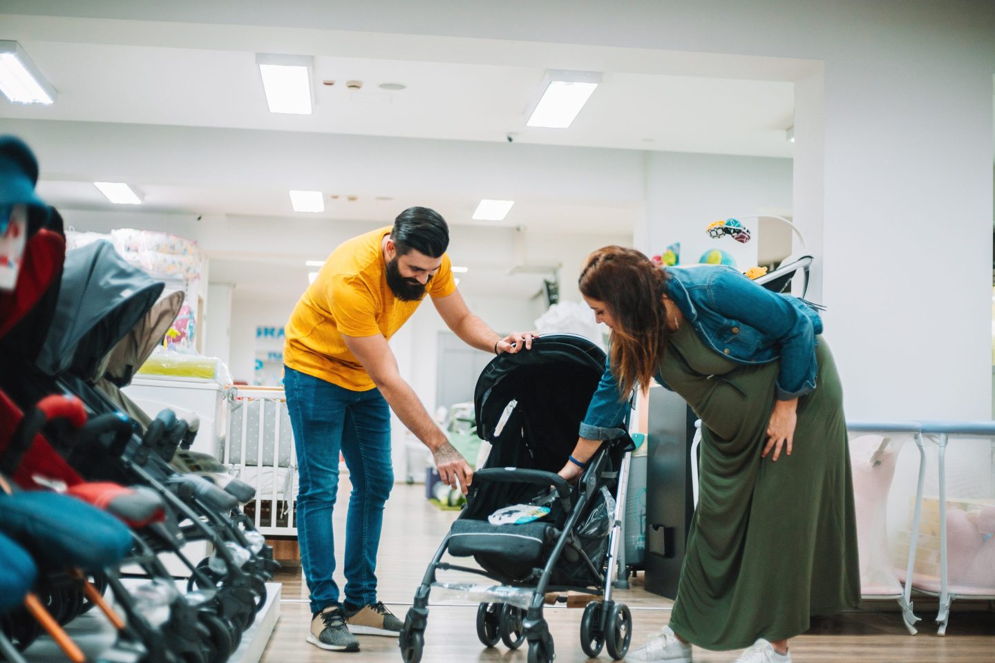 new parents shopping for stroller