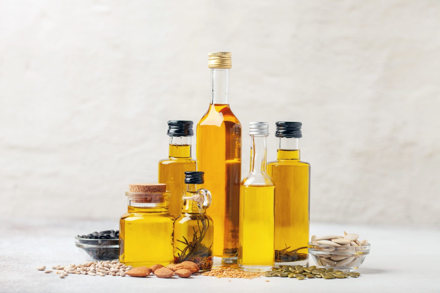 Various cooking oils in clear glass bottles