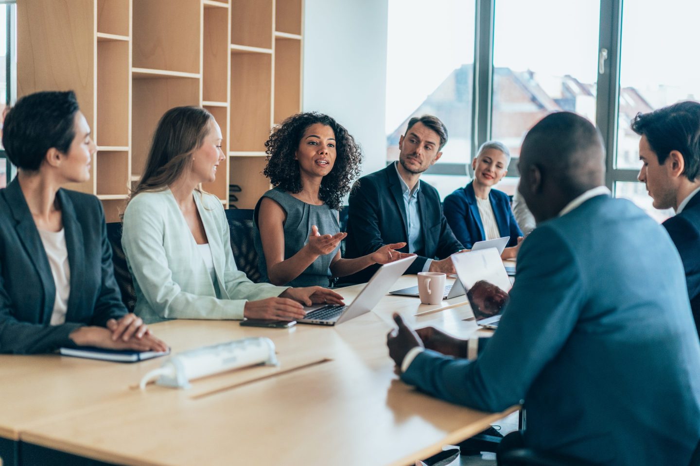 businesspeople sitting together and having a meeting in the office
