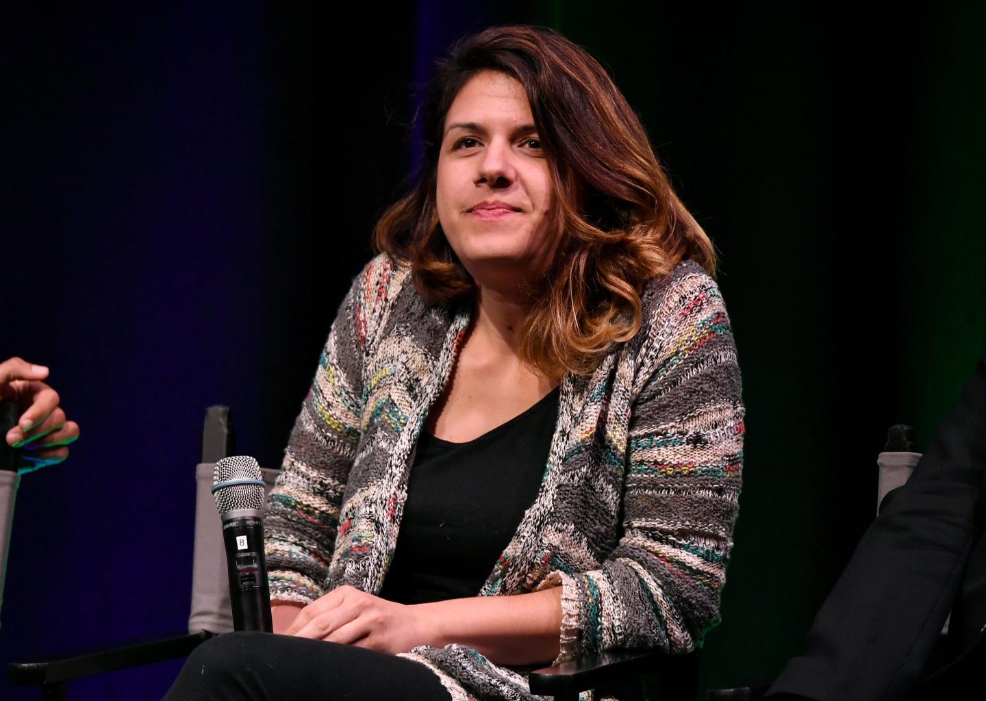 Parisa Tabris, general manager for Google Chrome, sits on a panel holding a microphone