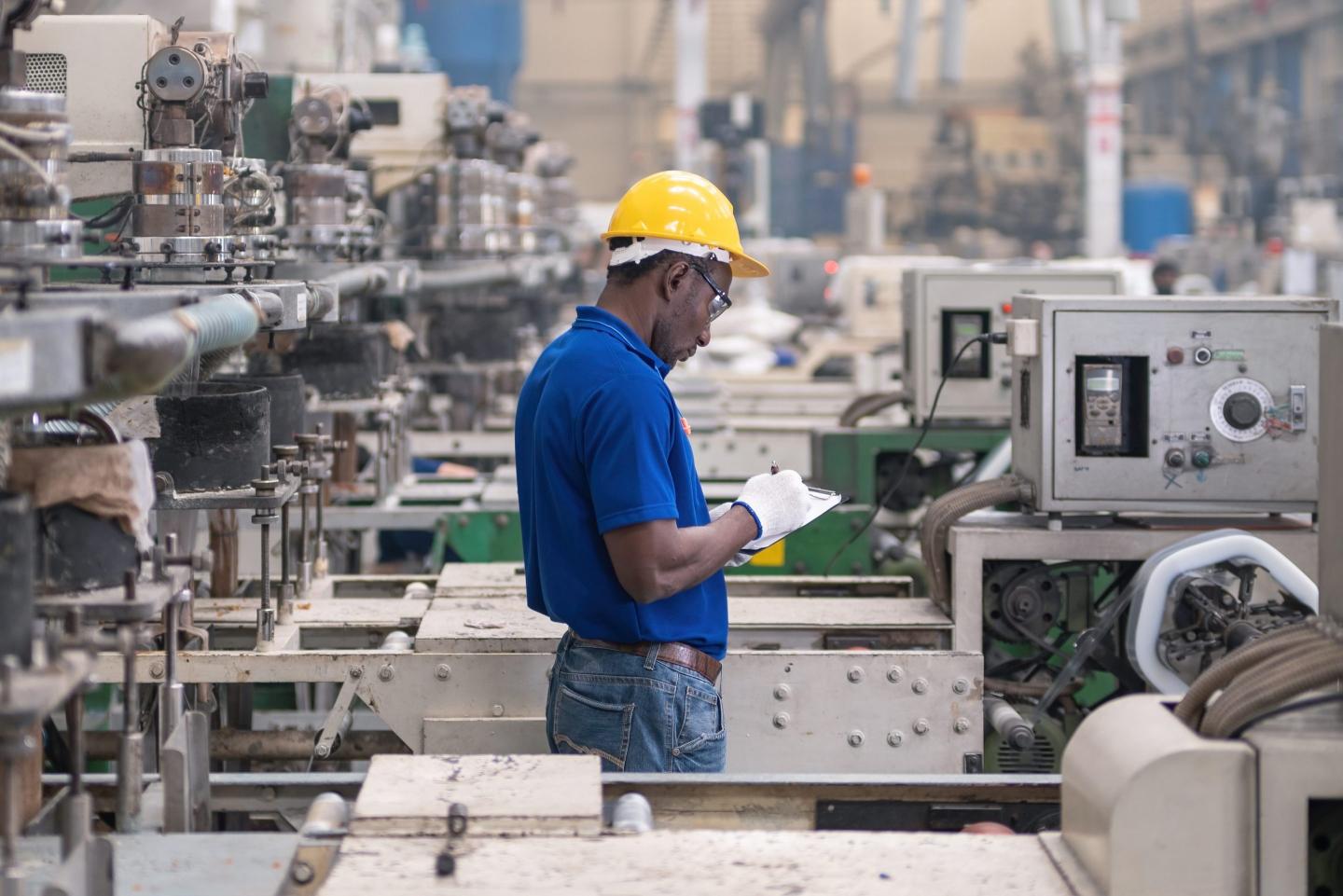 Factory worker on assembly line.