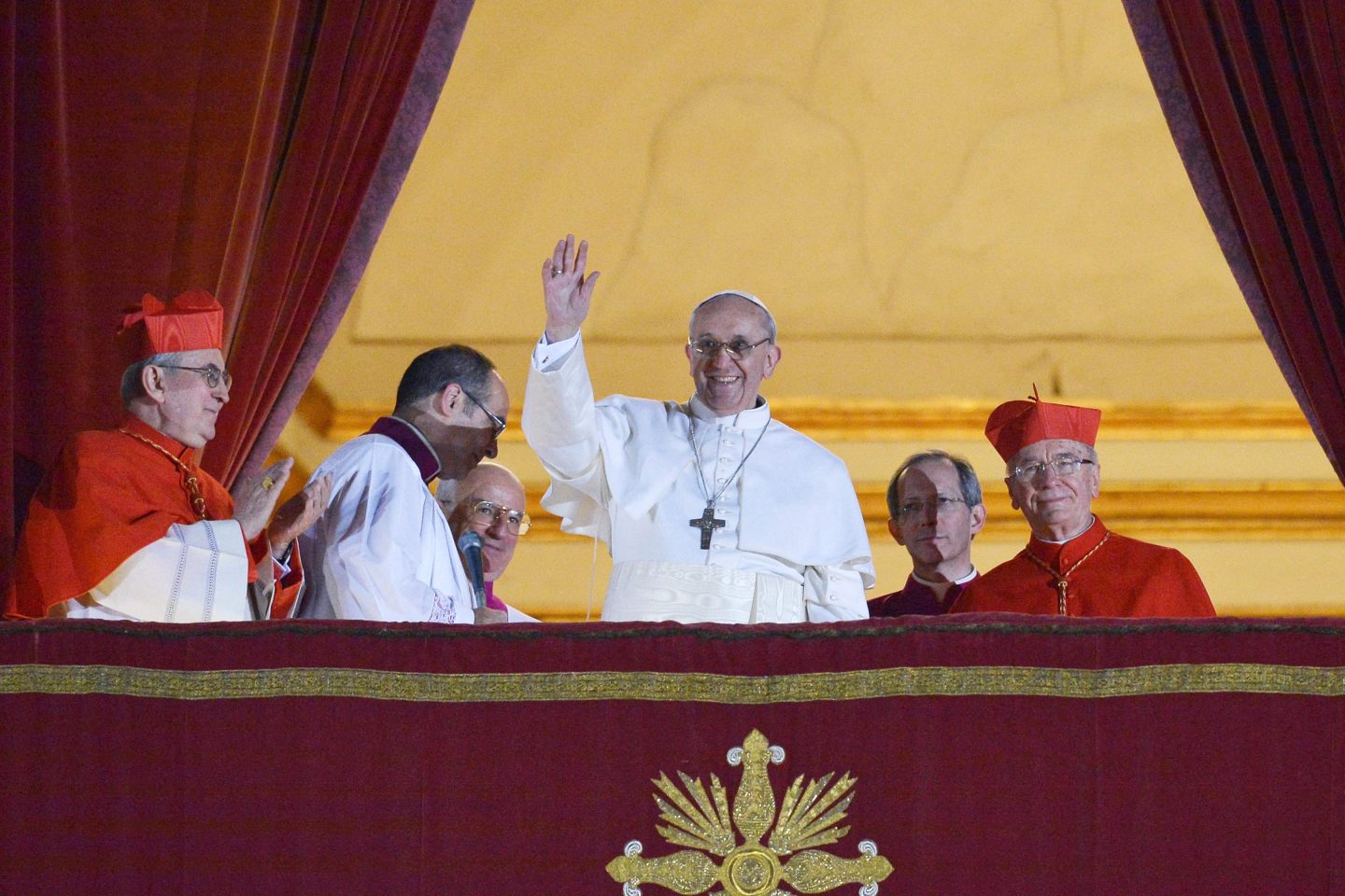 Argentina's Jorge Bergoglio, elected Pope Francis I (C) waves from the window of St Peter's Basilica's balcony after being elected the 266th pope of the Roman Catholic Church on March 13, 2013 at the Vatican.