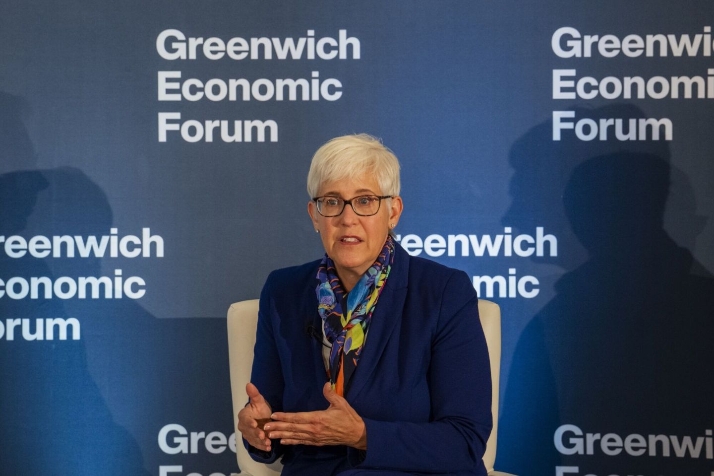 Lisa Audet from Tall Trees Capital Management speaks at an event