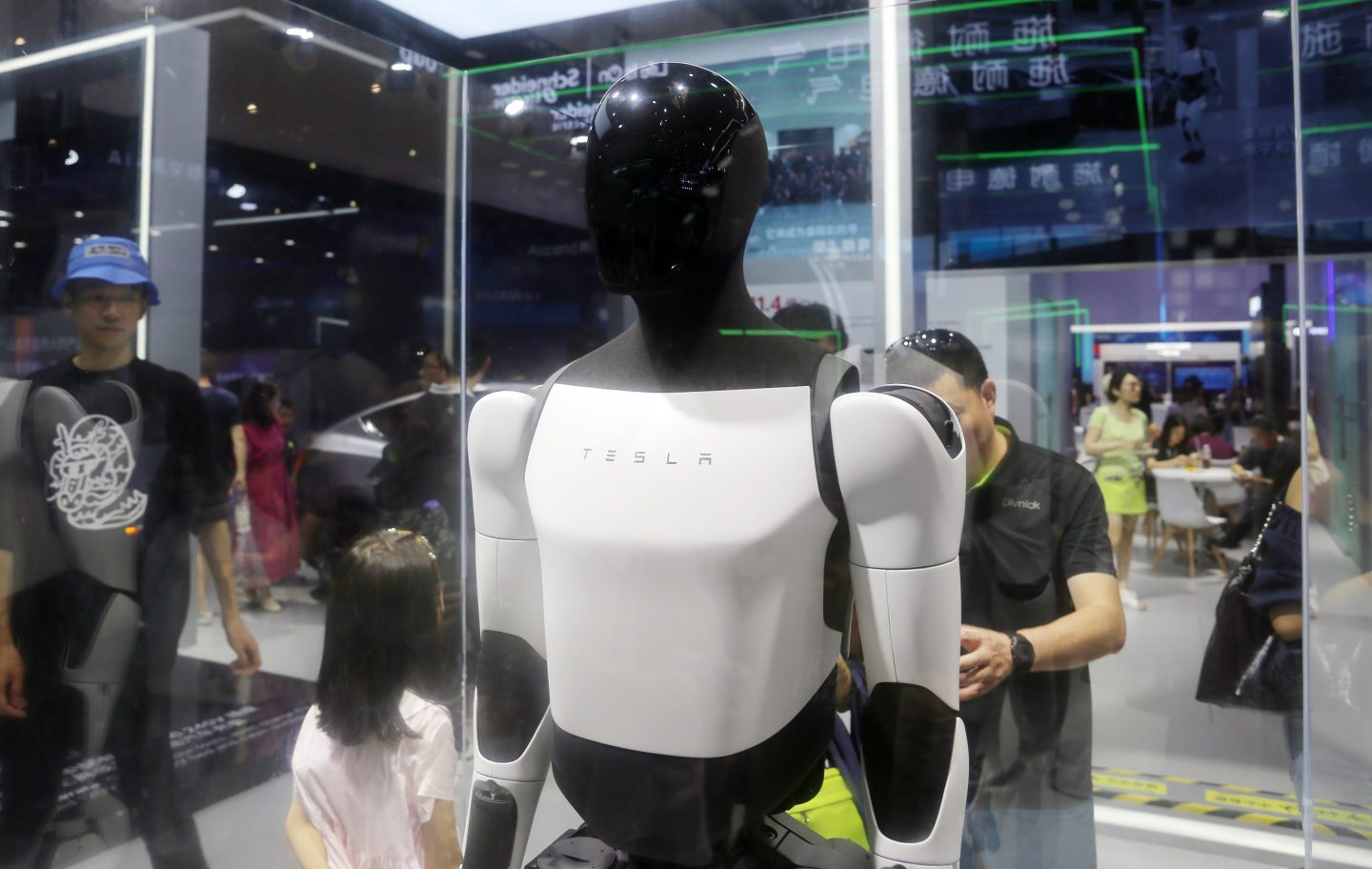 Visitors view the Tesla humanoid robot Optimus Prime II at the World AI Conference (WAIC) in Shanghai, July 7, 2024.