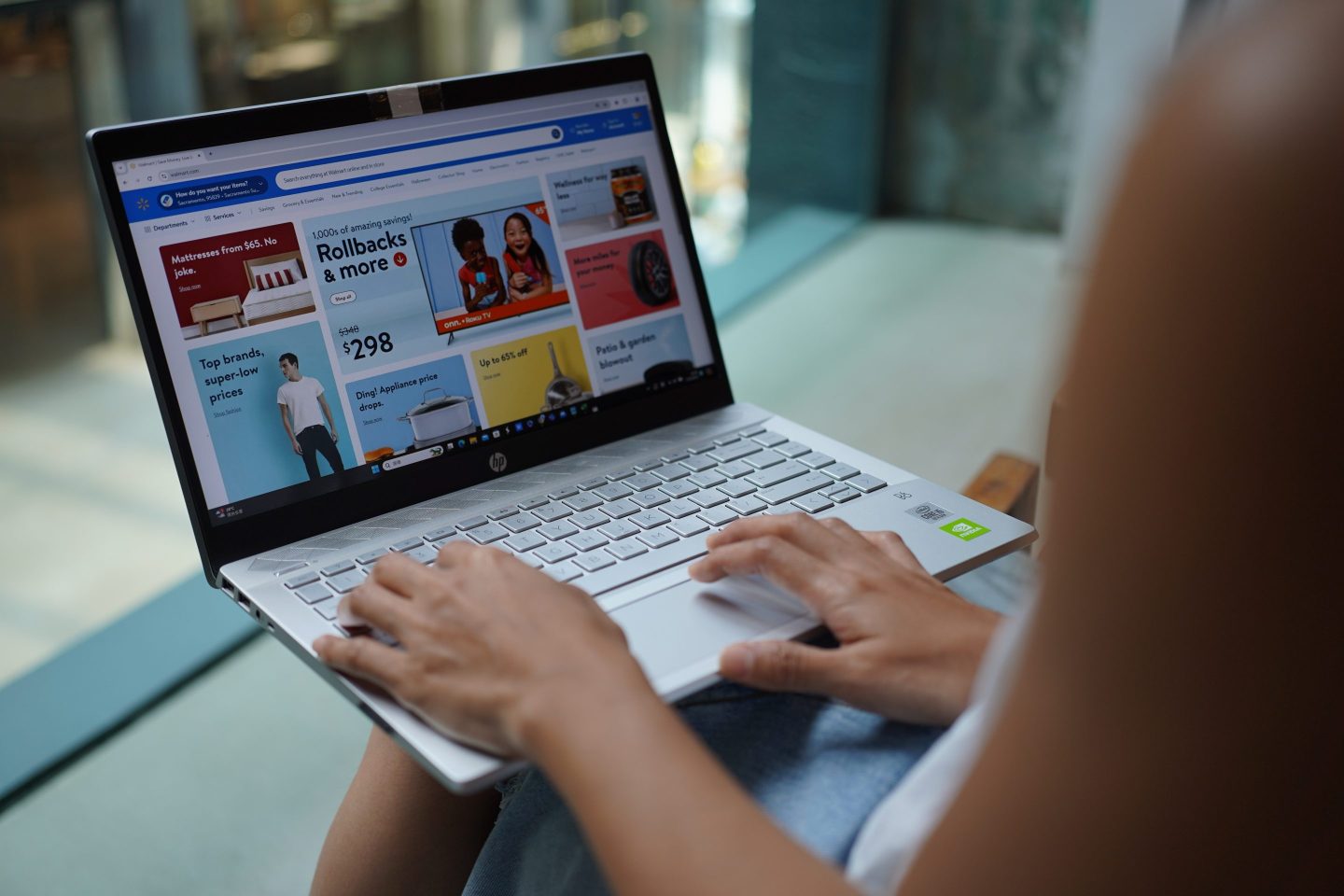 woman looking at walmart website on her computer