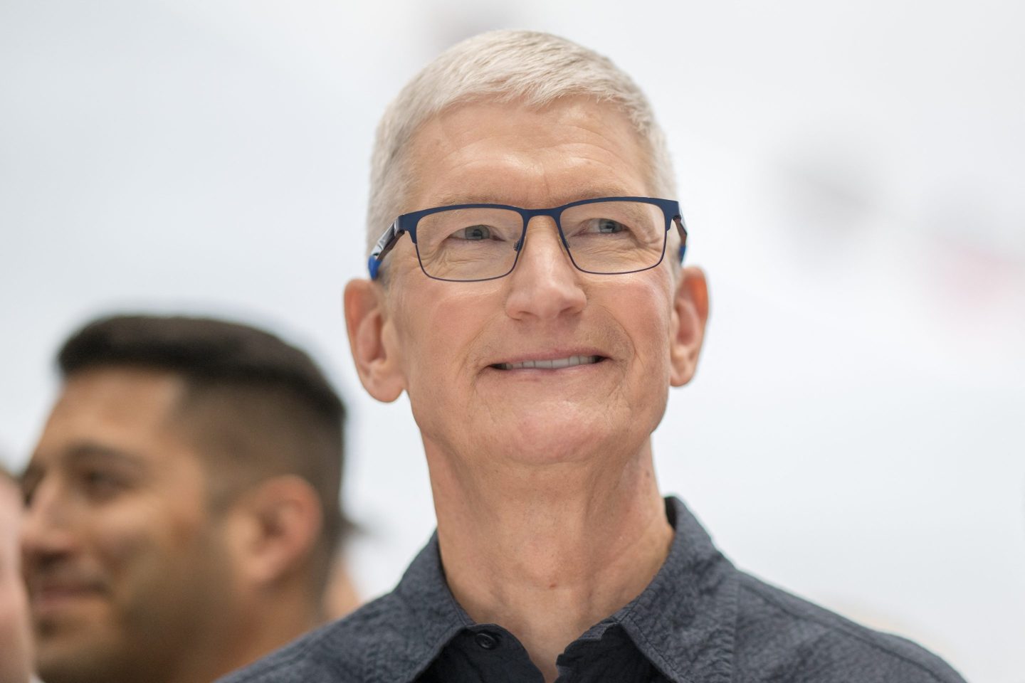 Apple CEO Tim Cook looks at new iPhone models following Apple’s “It‘s Glowtime” event in Cupertino, Calif., Sept. 9, 2024.