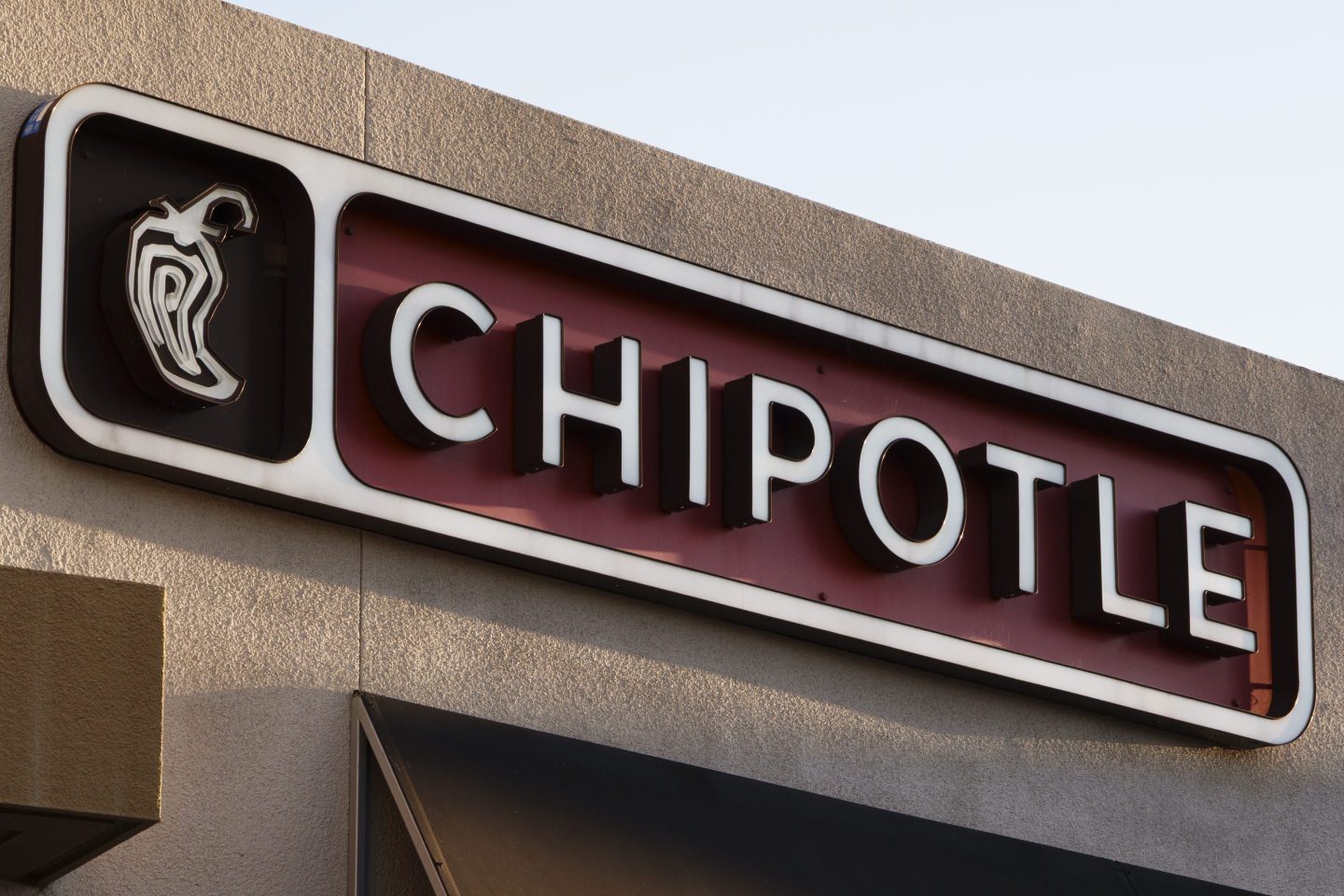 A Chipotle logo is displayed outside their restaurant