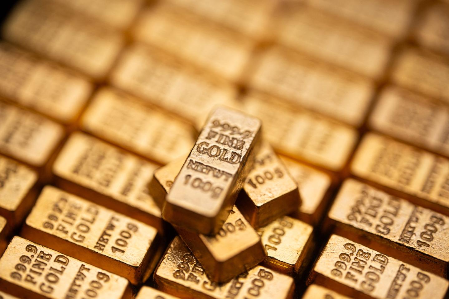 Fake gold bars stacked on top of others
