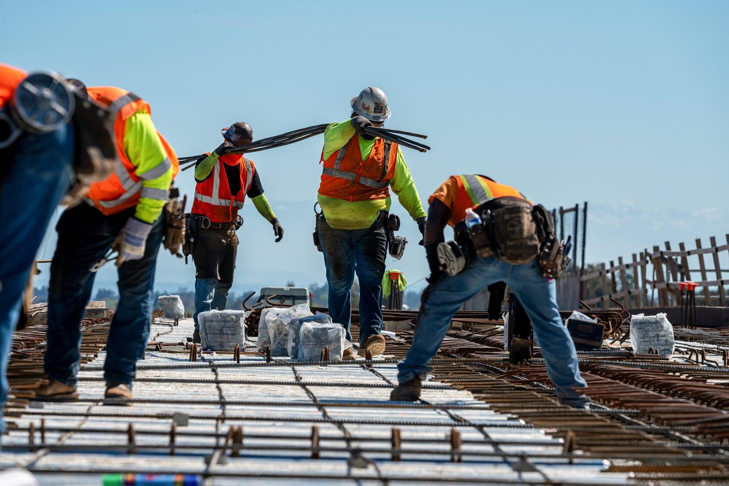 Construction workers wearing high vis vests
