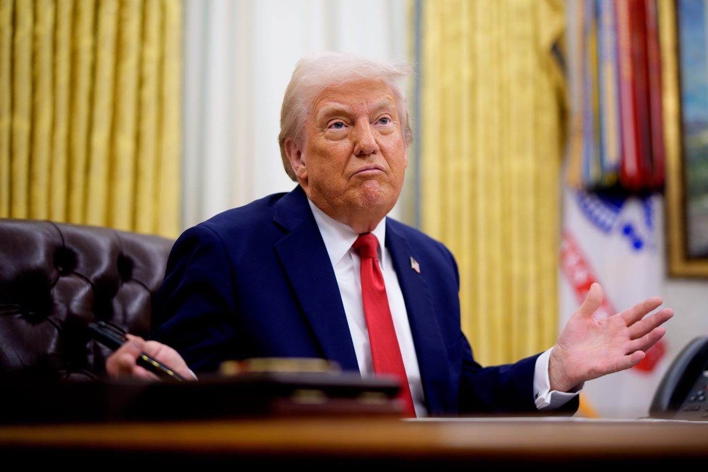 President Donald Trump gestures while speaking during an executive order signing event in the Oval Office of the White House on March 31, 2025 in Washington, DC.