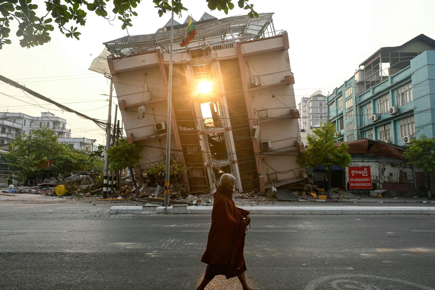 Myanmar rescuers save 63-year-old woman from rubble 91 hours after being buried but hope of finding more earthquake survivors fades after death toll passes 2,700
