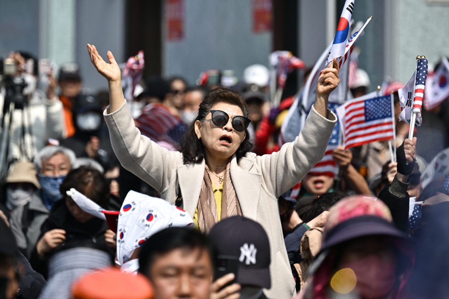 Supporters of South Korea president Yoon Suk Yeol react after the Constitutional Court's verdict on Yoon's impeachment outside the presidential residence in Seoul on April 4, 2025.