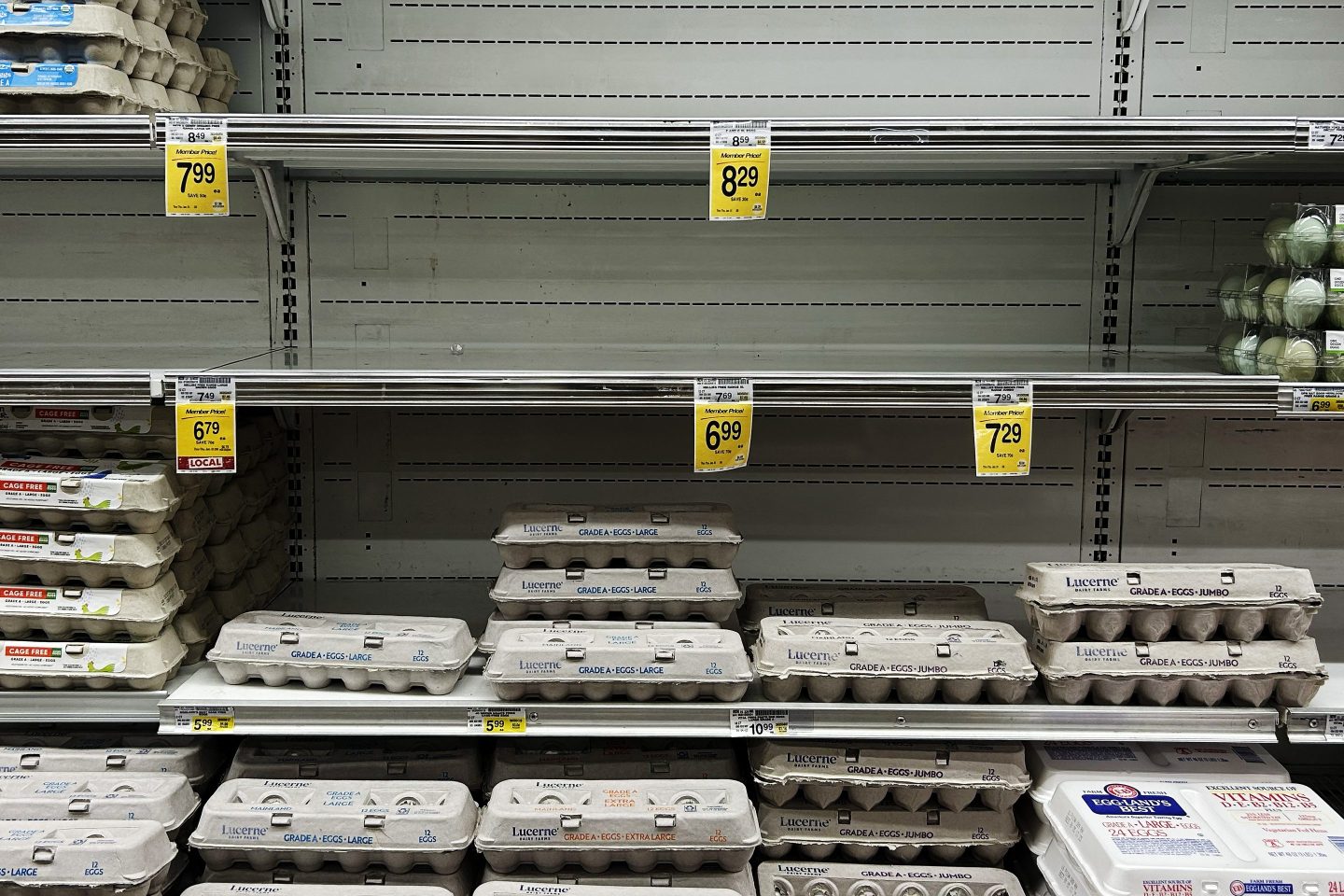 Half-full shelves in a supermarket egg section