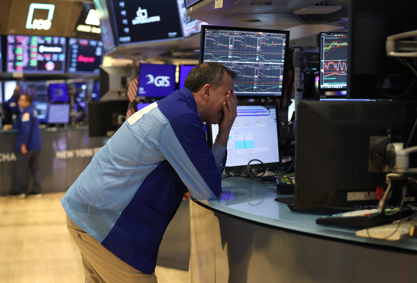 Traders work on the floor of the New York Stock Exchange on Friday.