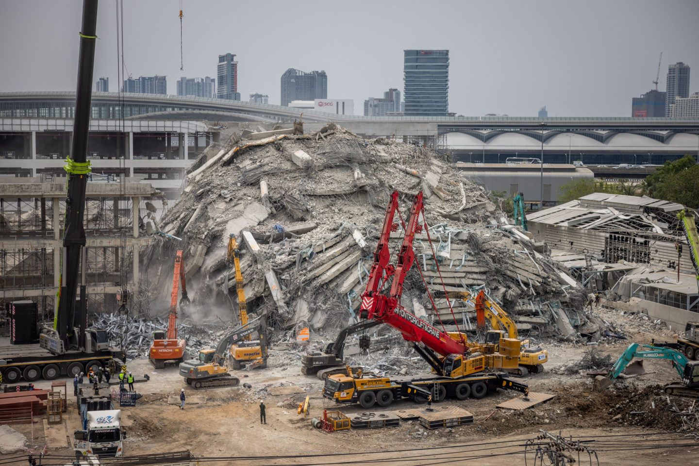 Thai and search and rescue teams work to recover victims of the construction building collapse on April 02, 2025 in Bangkok.