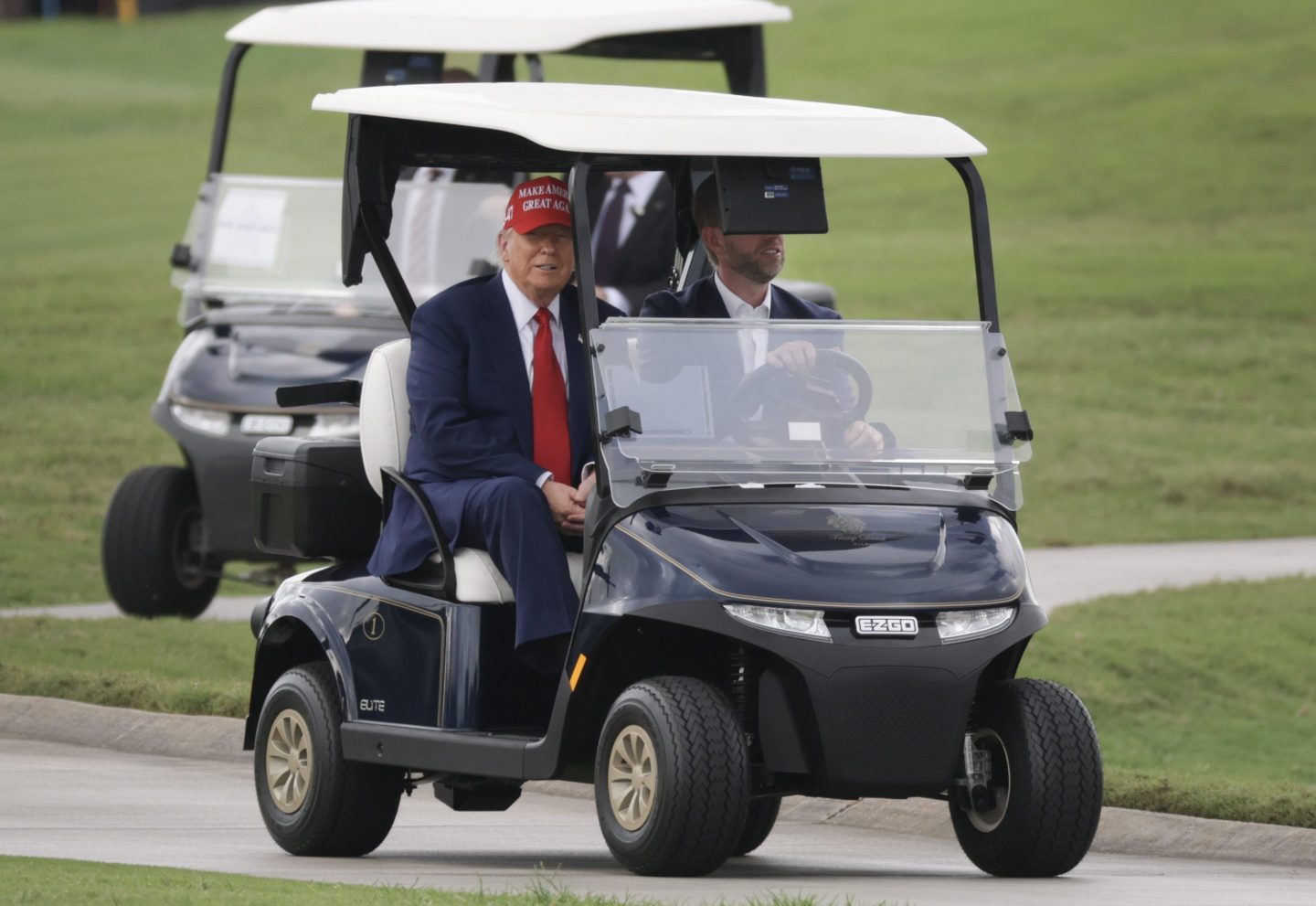 President Donald Trump and his son Eric Trump on Thursday during the LIV Golf tournament being held at his Trump National Doral Golf Club.