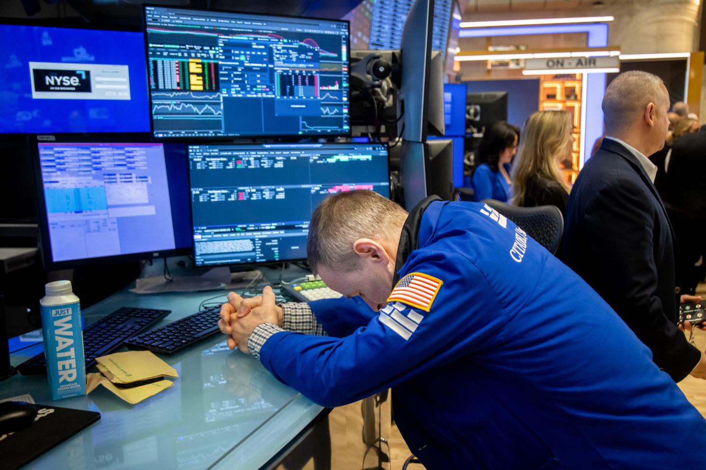 Traders work on the floor of the New York Stock Exchange (NYSE) in New York, US, on Monday, April 7, 2025.