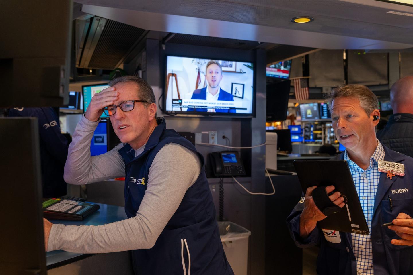 Traders work on the floor of the New York Stock Exchange