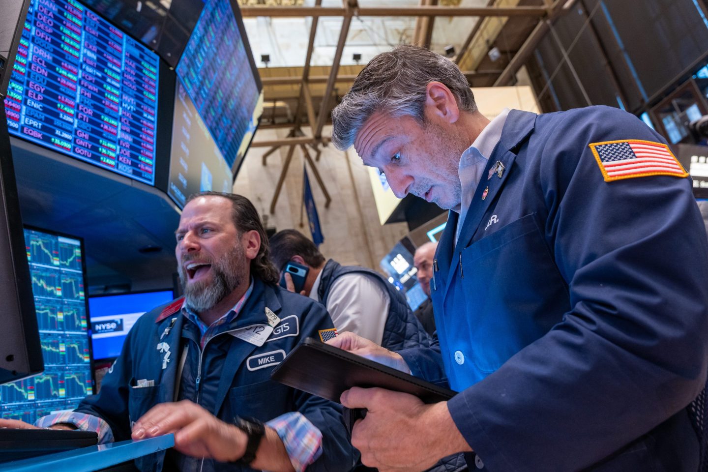 Traders on the floor of the New York Stock Exchange as stocks fall.