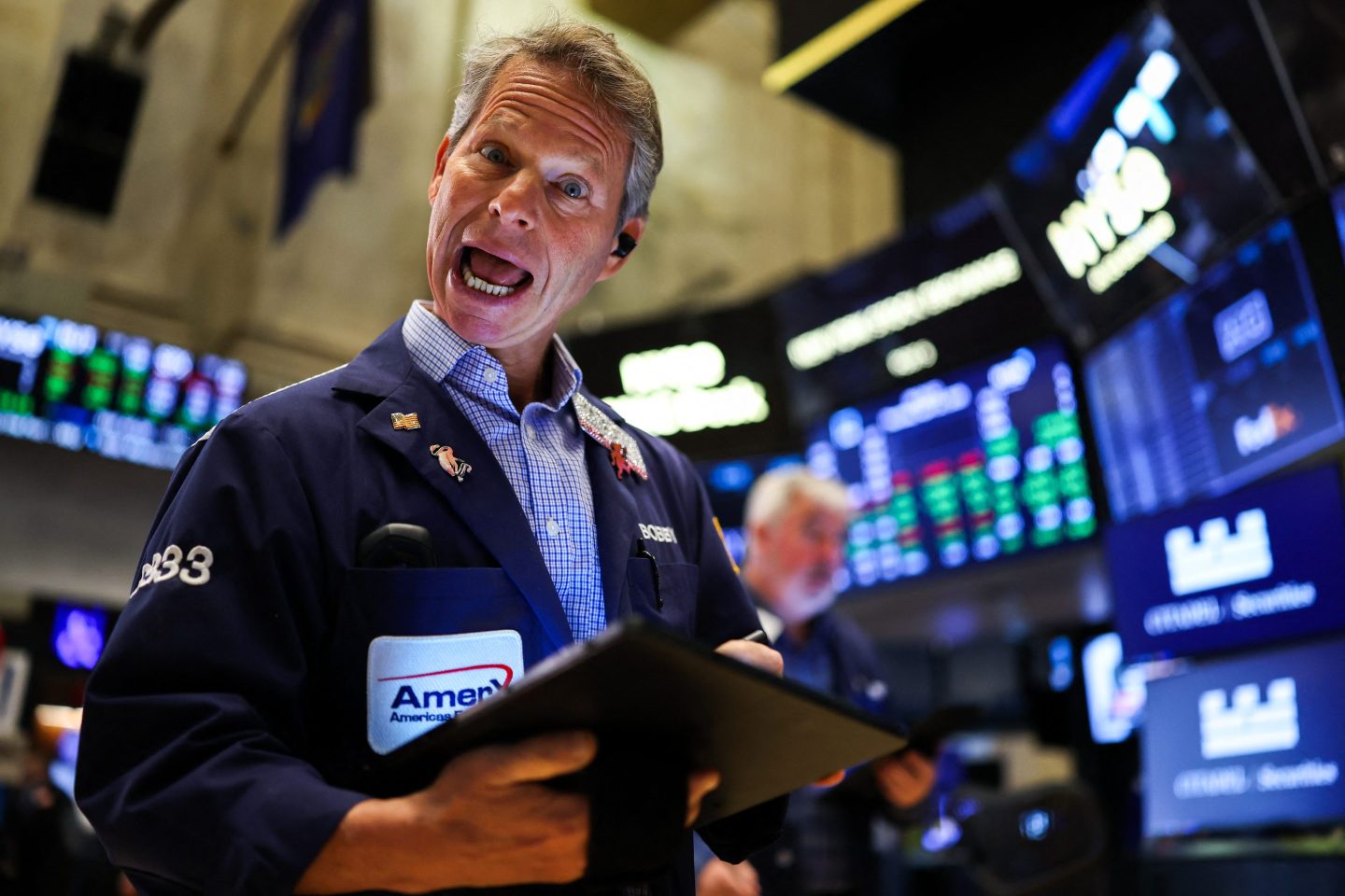 A trader on the floor of the New York Stock Exchange at the opening bell on Thursday.