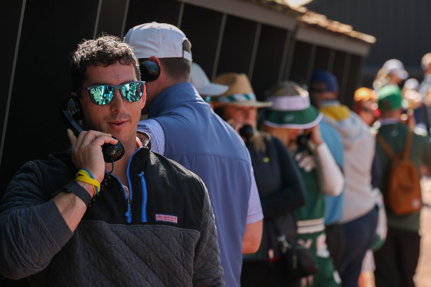 person talking on phone at masters tournament