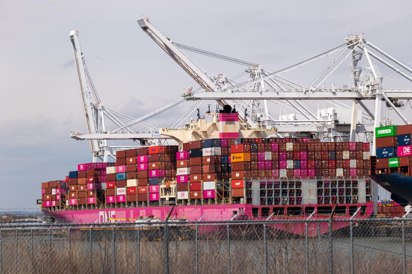 Containers are loaded and unloaded from cargo ships at Port Liberty on April 10 in Bayonne, New Jersey.
