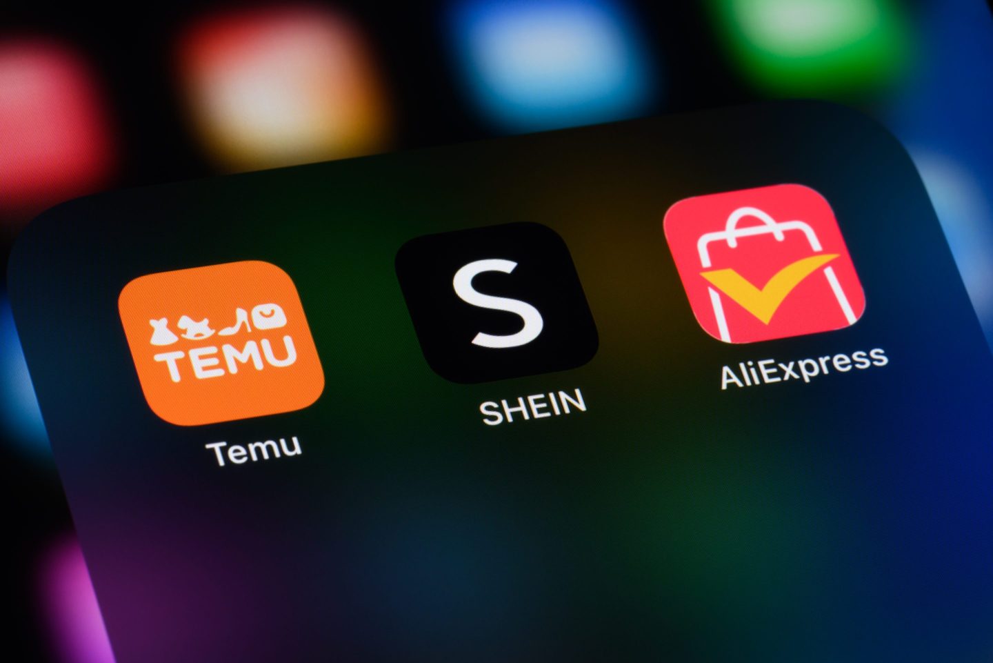 Chinese e-commerce apps on a smartphone - Temu, Shein, and AliExpress