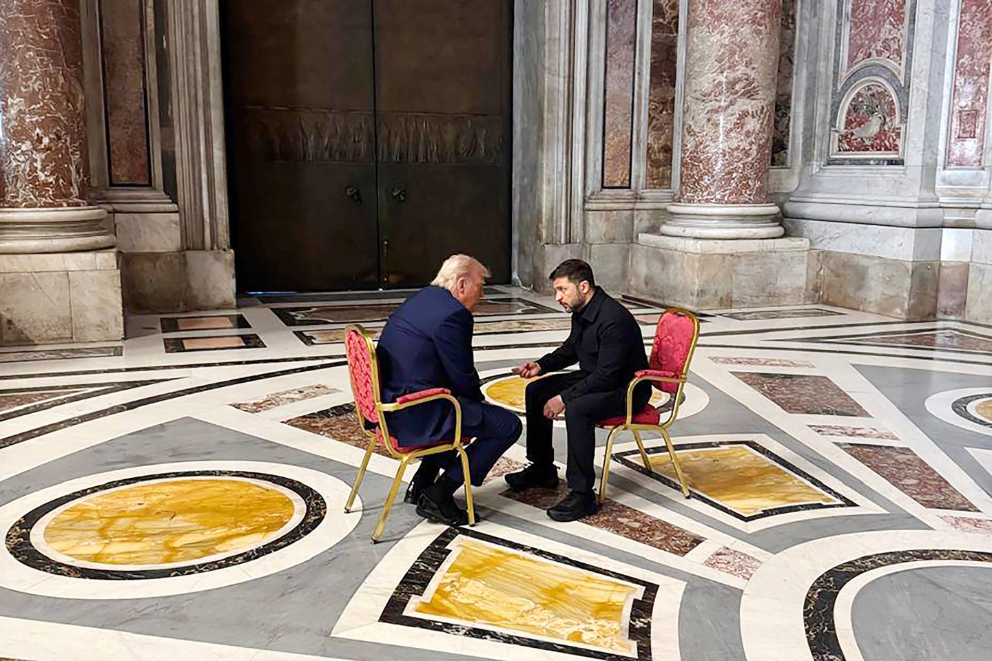 Trump and Zelensky sit in chairs face to face during Pope Francis' funeral