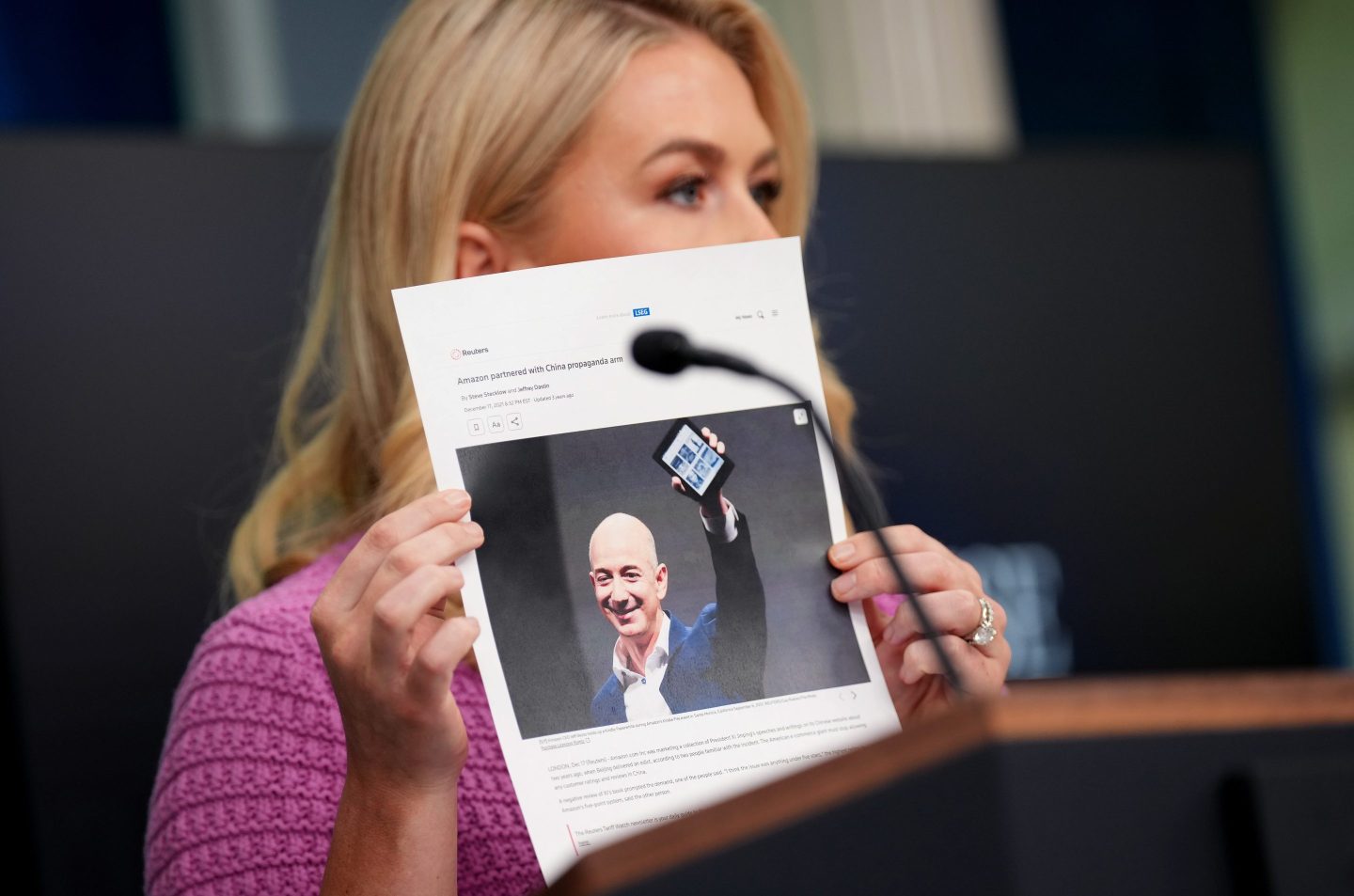 Karoline Leavitt holds up a picture of Jeff Bezos