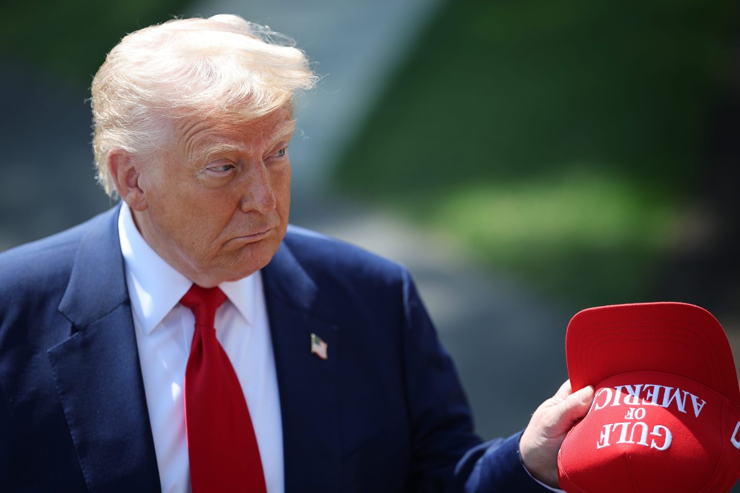 President Donald Trump answers questions from the media outside the White House on Tuesday.