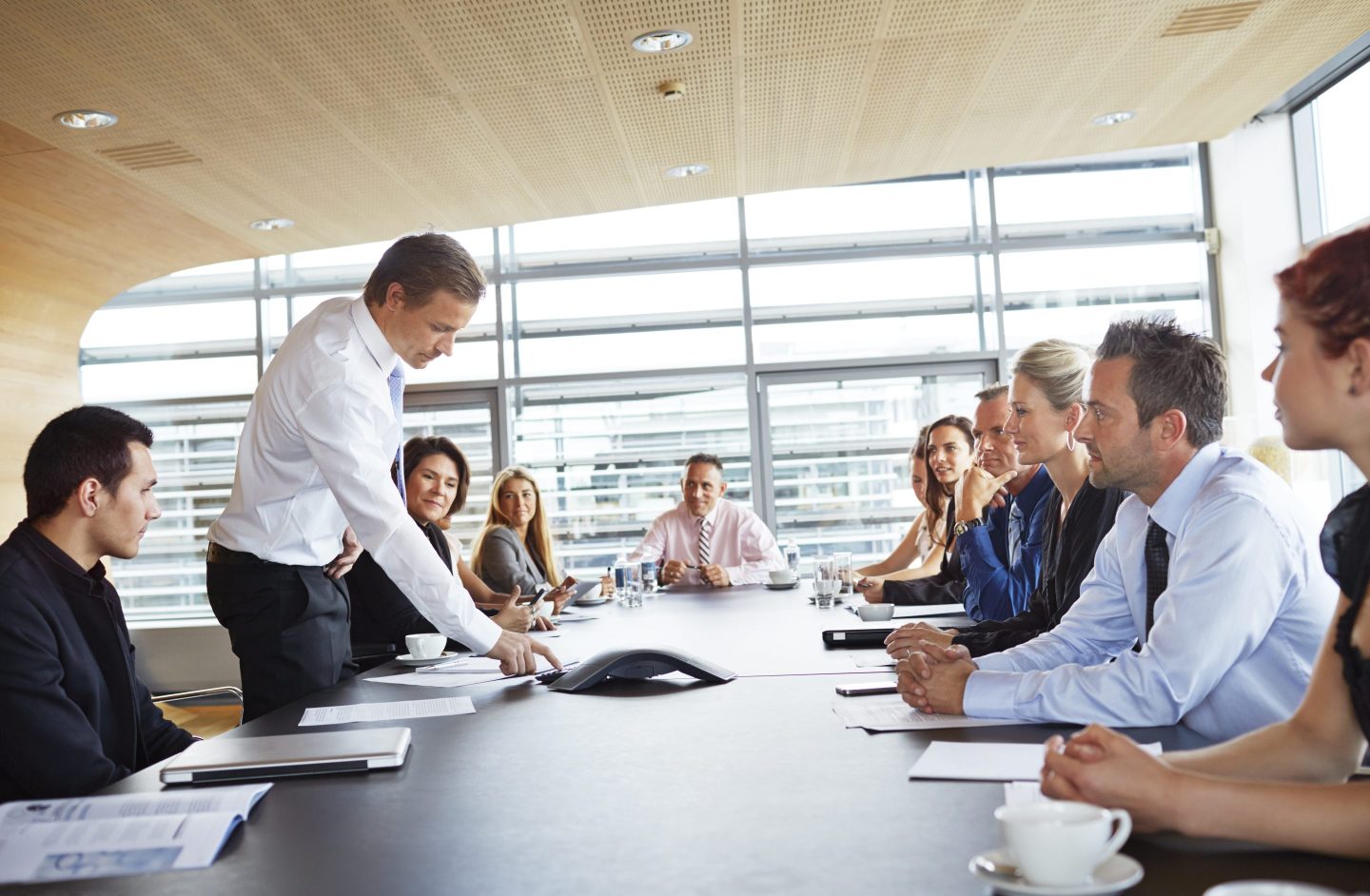business professionals convening at a conference table