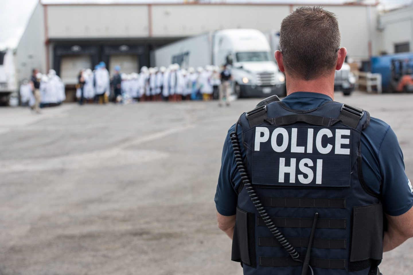 Homeland Security Investigations (HSI) special agent preparing to arrest alleged immigration violators