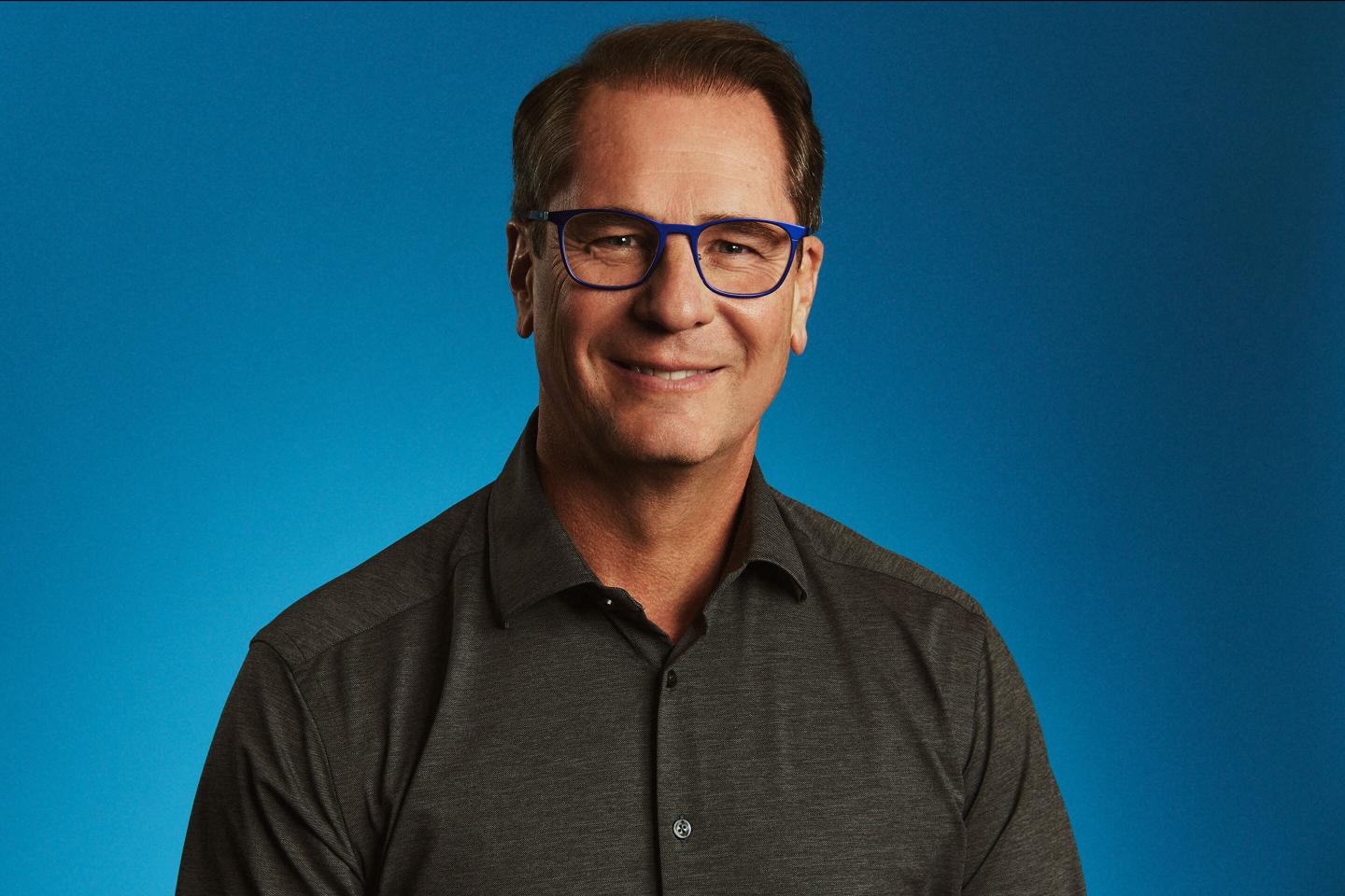 Philip Moyer with a blue background