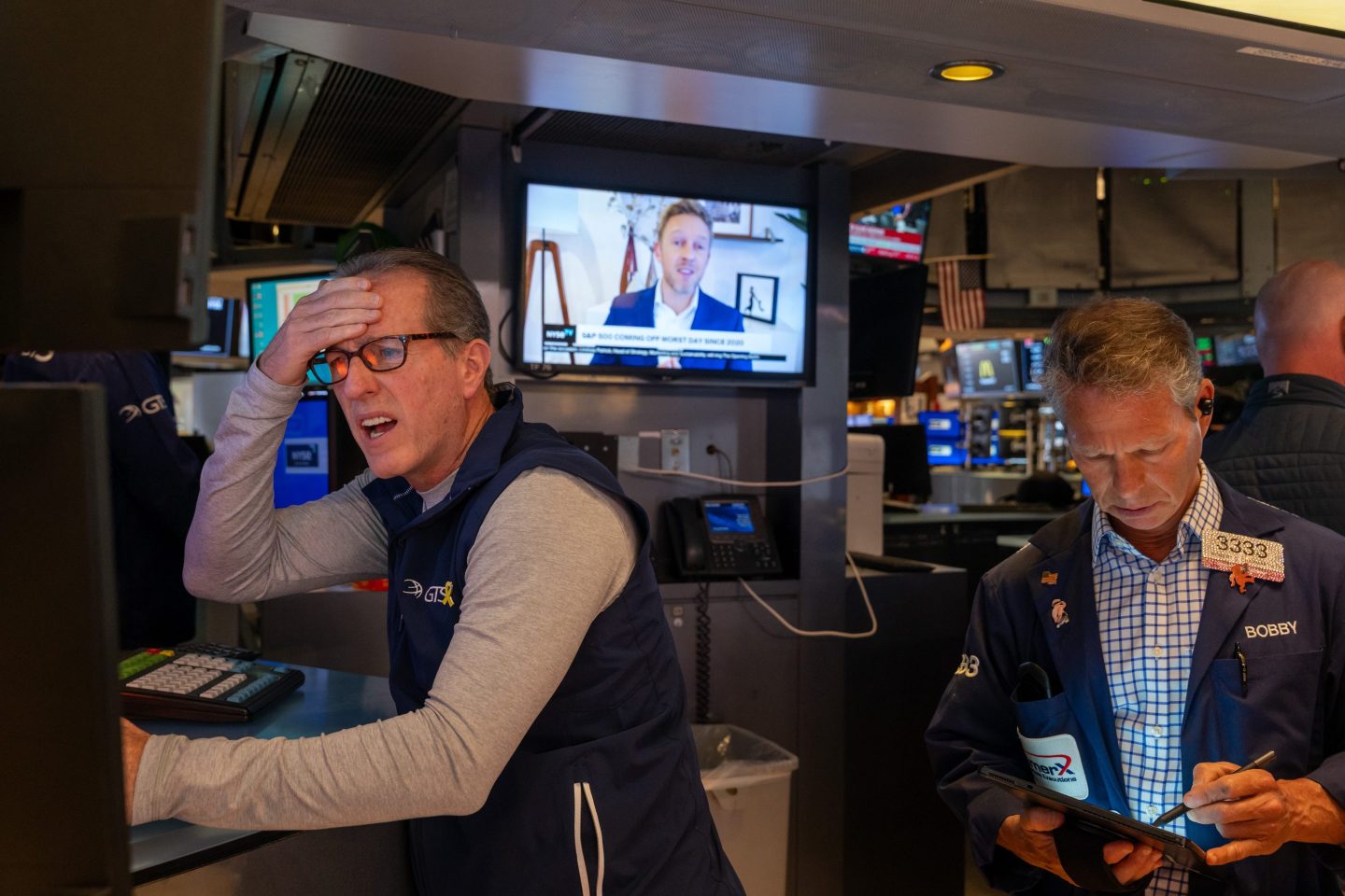 Traders work on the floor of the New York Stock Exchange