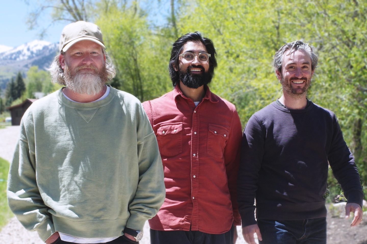 General Medicine's three-person founding team poses for a photo outside with trees in the background