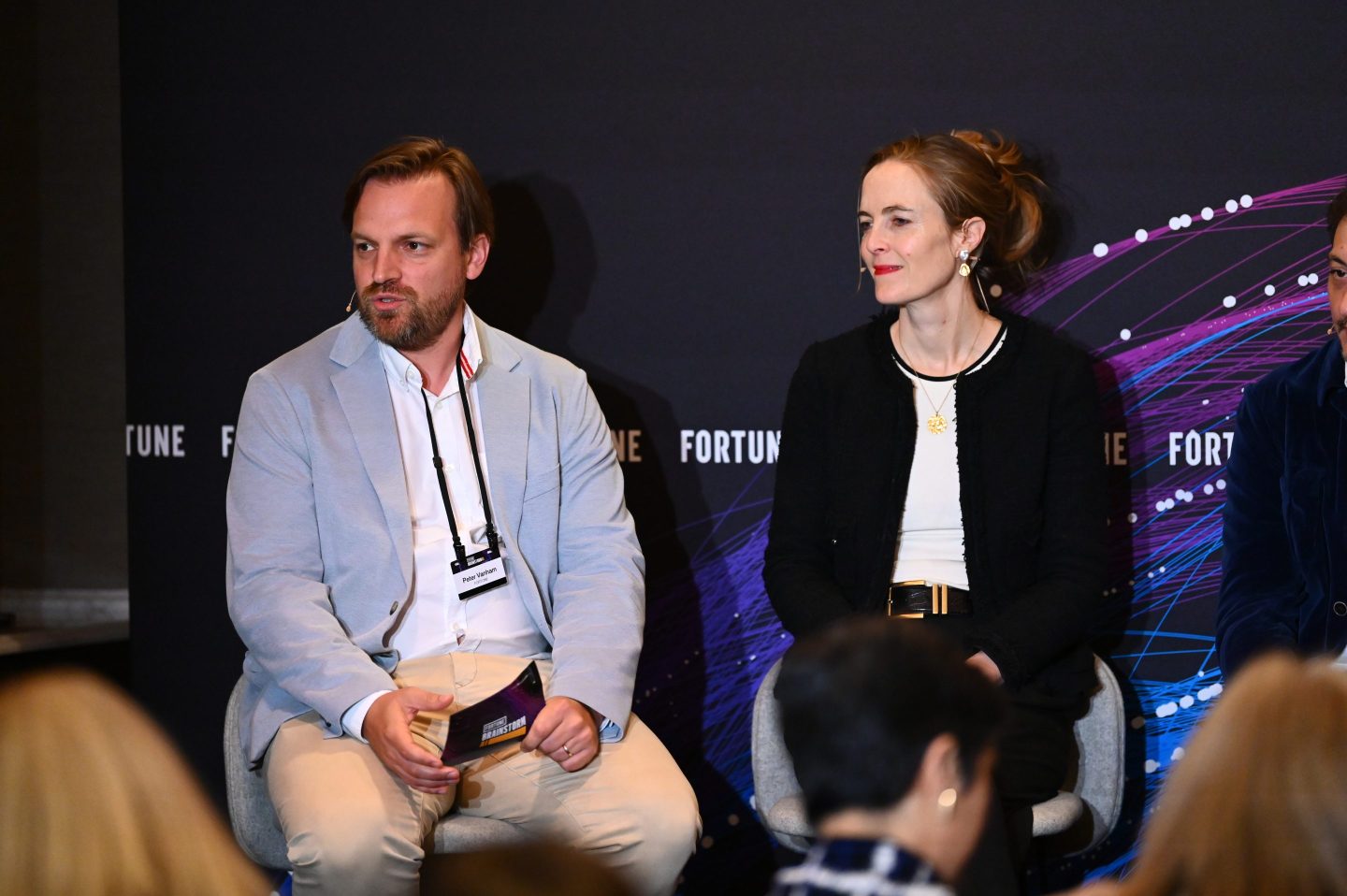 peter vanham and robyn scott sitting at a panel