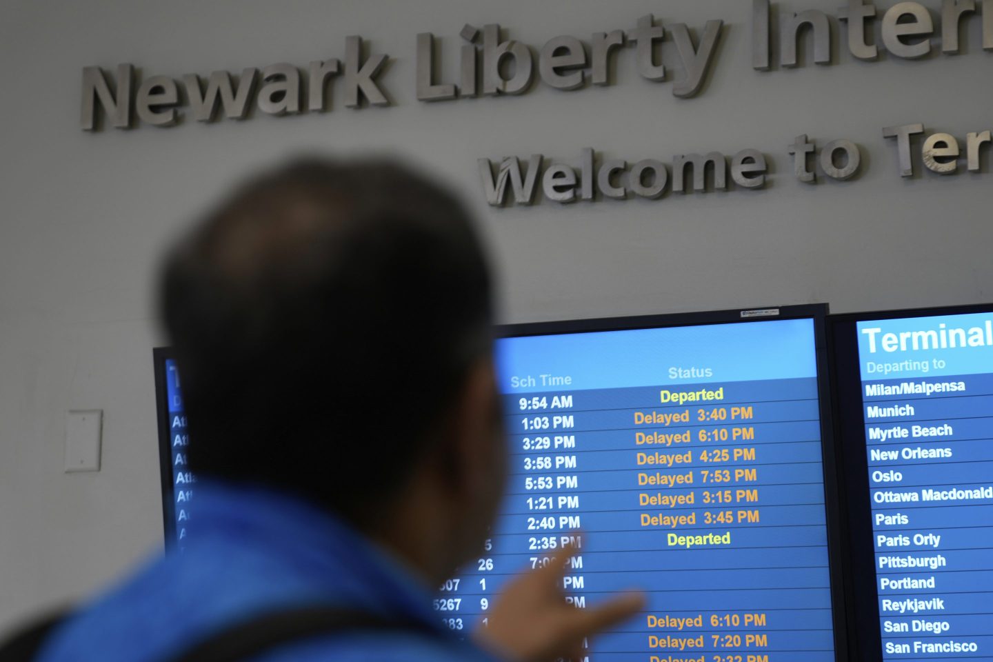 A display shows the status of flights at Newark Liberty International Airport on May 5, 2025.