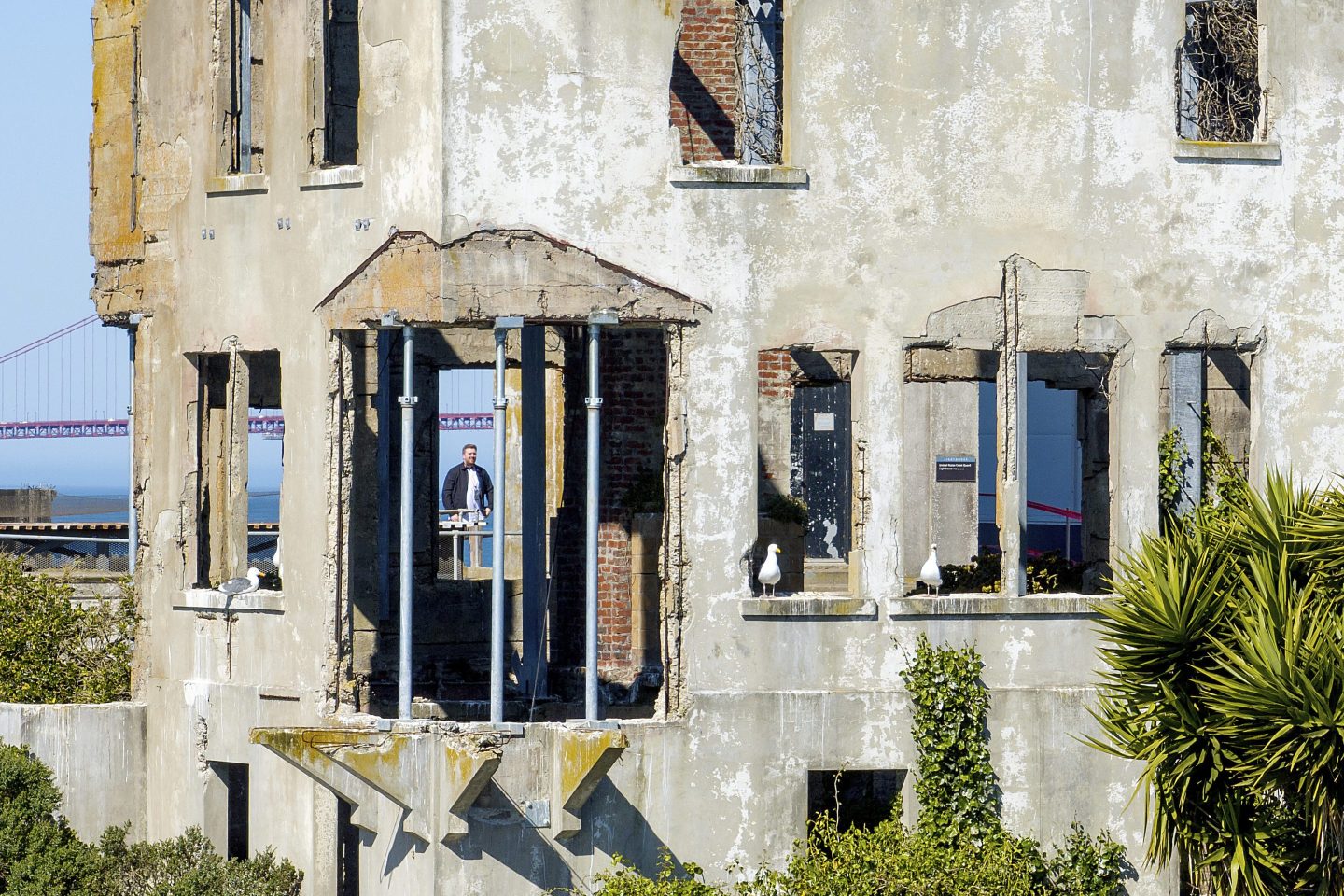 A visitor looks at the warden's house at Alcatraz Island on May 5, 2025, in San Francisco.