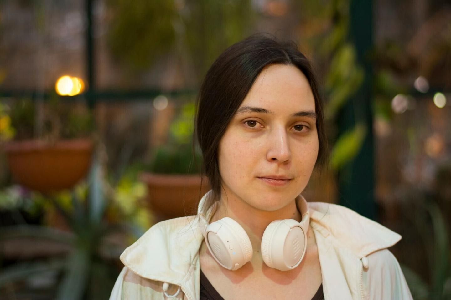 Kseniia Petrova wearing a pair of headphones