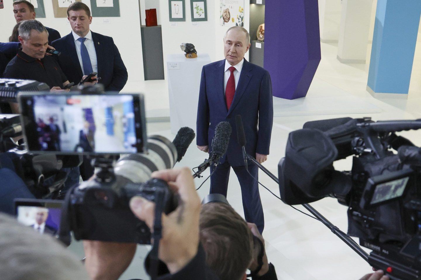 Russian President Vladimir Putin speaks to journalists on Monday after his phone talks with U.S. President Donald Trump.