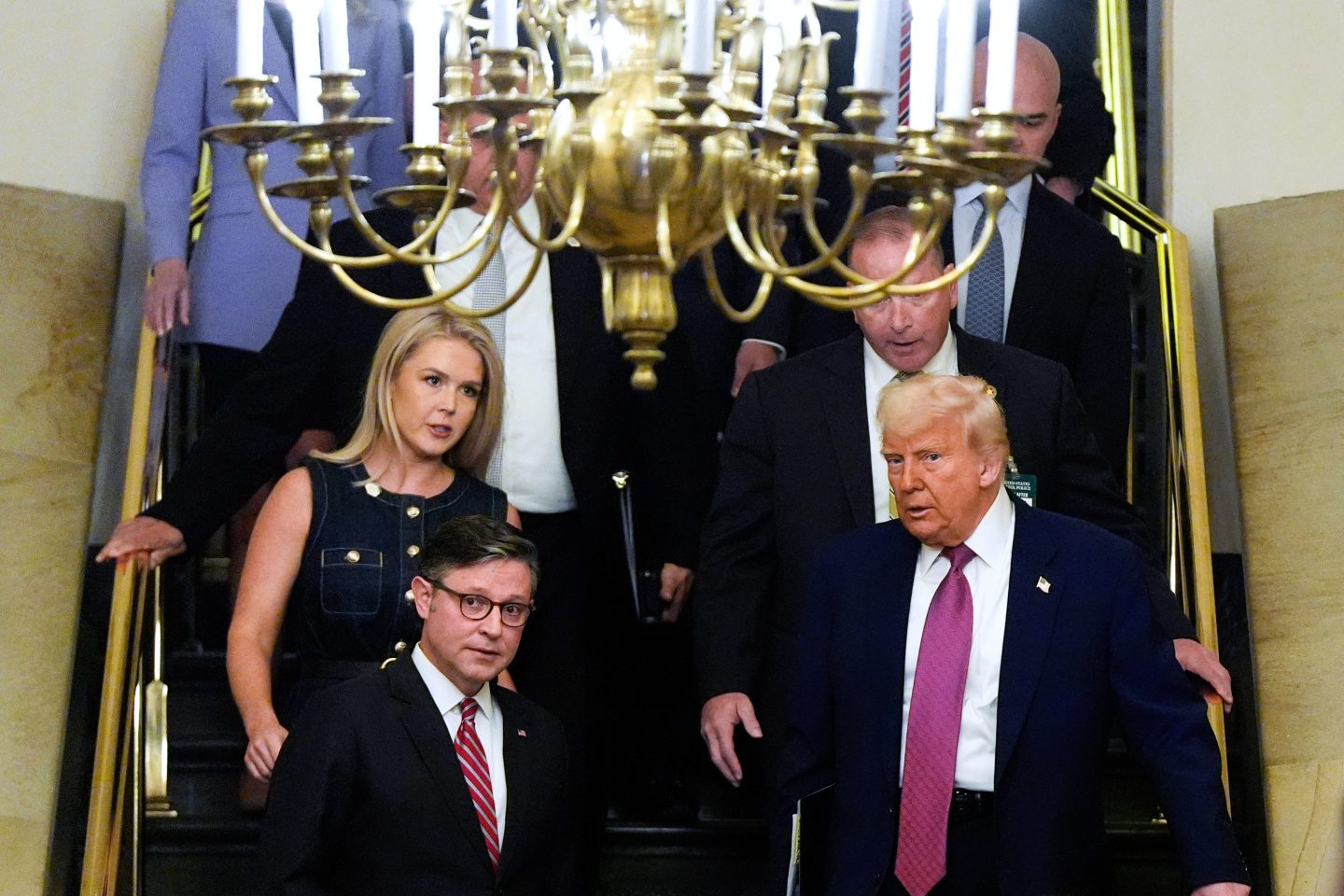 Speaker of the House Mike Johnson, R-La., and President Donald Trump arrive for a House Republican conference meeting, on May 20, 2025, at the U.S. Capitol in Washington.