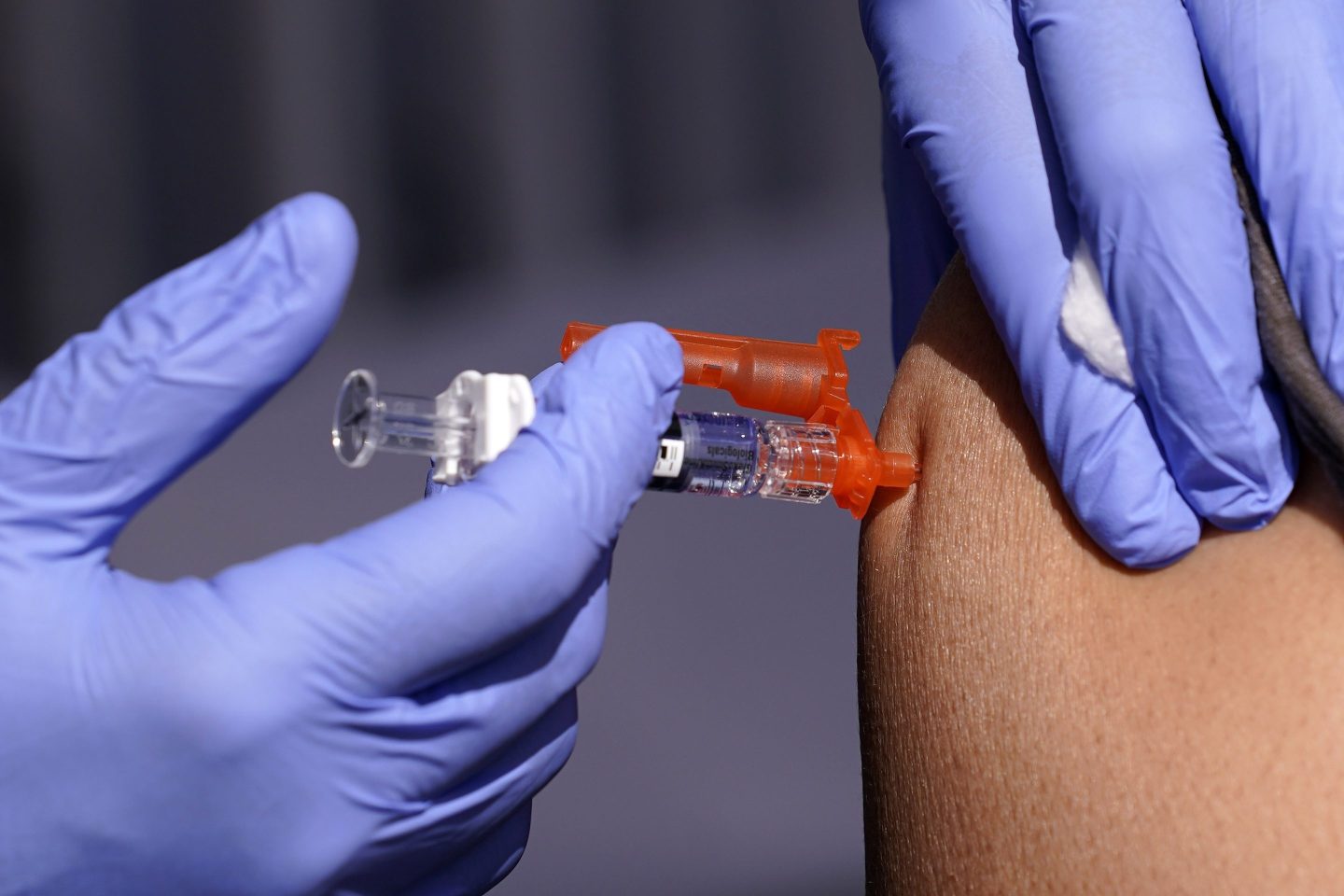 A patient is given a flu vaccine Oct. 28, 2022, in Lynwood, Calif.