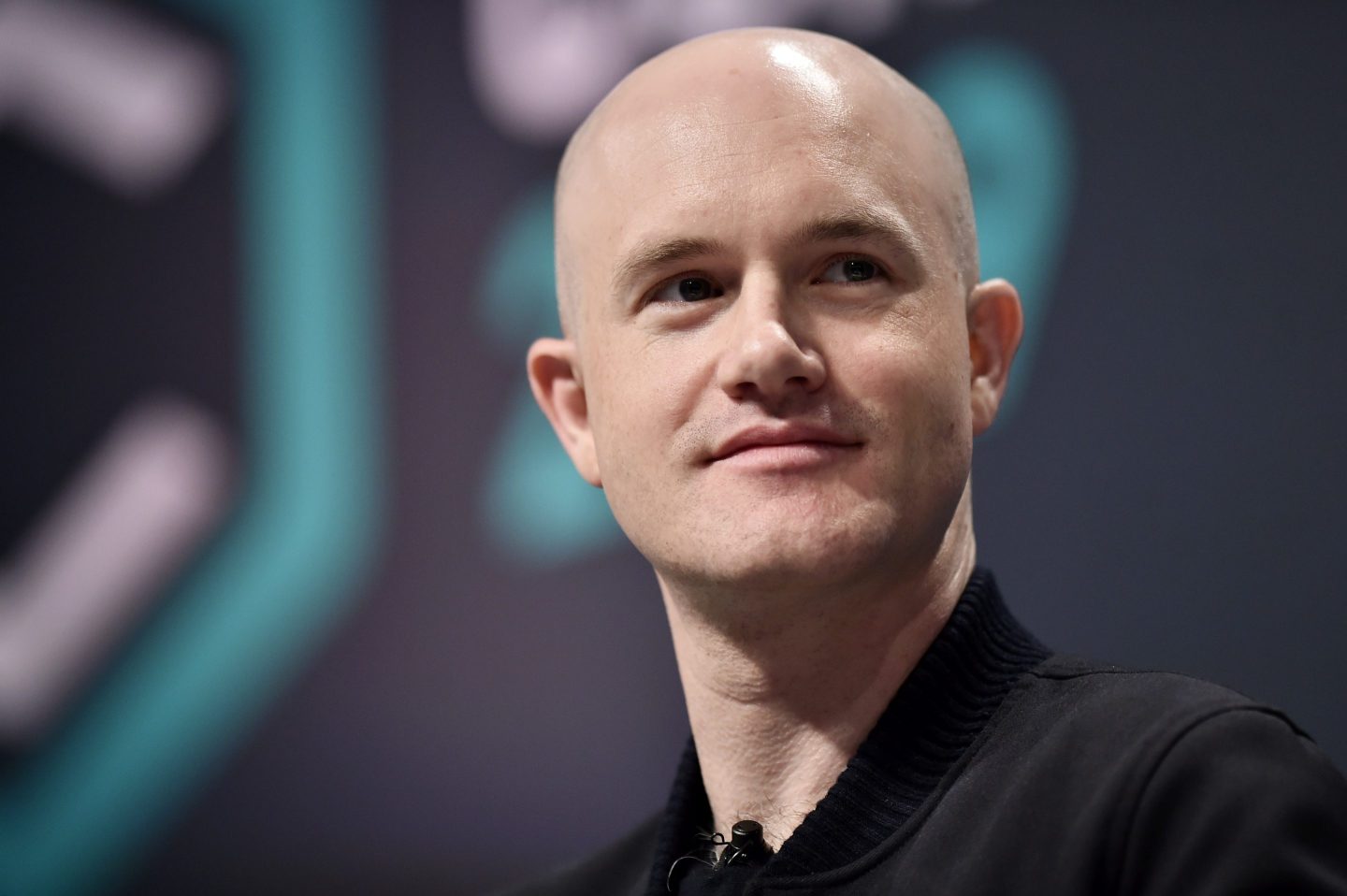 Coinbase founder and CEO Brian Armstrong smiles