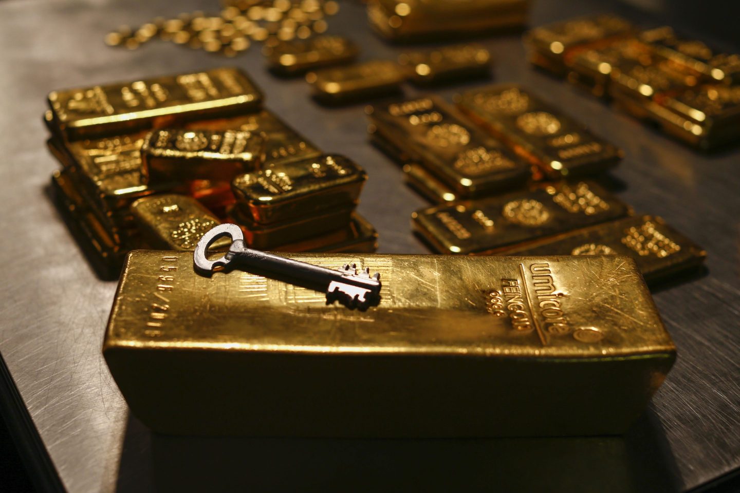 A safety deposit box key rests on a gold bar weighing 12.5 kilograms in the precious metals vault at Pro Aurum KG in Munich, Germany, on Wednesday, July 10, 2019. Gold rose for a third day after the Federal Reserve indicated that its preparing to cut interest rates for the first time in a decade as the global economy slows.