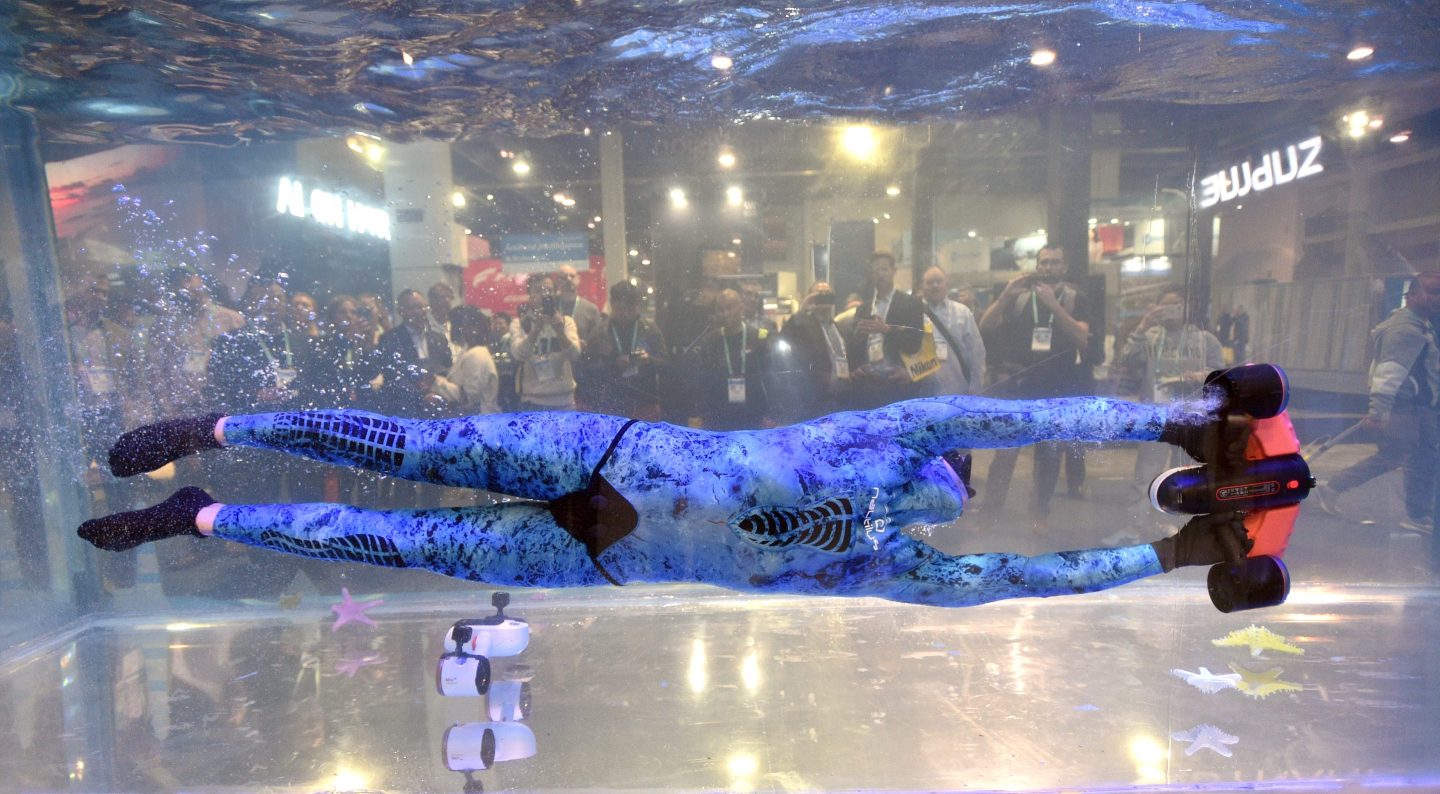 A model demonstrates Sublue's Seabow, a smart electric underwater scooter, during CES 2020 at the Las Vegas Convention Center on Jan. 8, 2020 in Las Vegas.