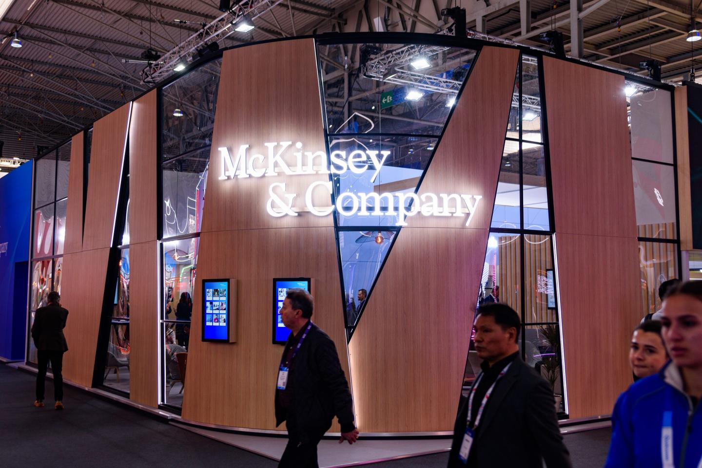 people walking near McKinsey & Co. sign