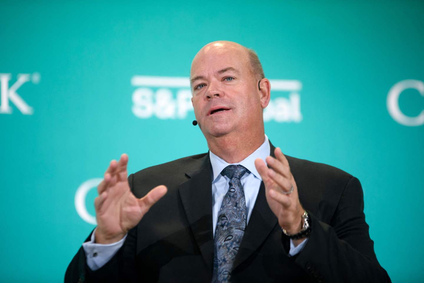 ConocoPhillips CEO Ryan Lance speaks while seated on stage at an energy conference in Houston.